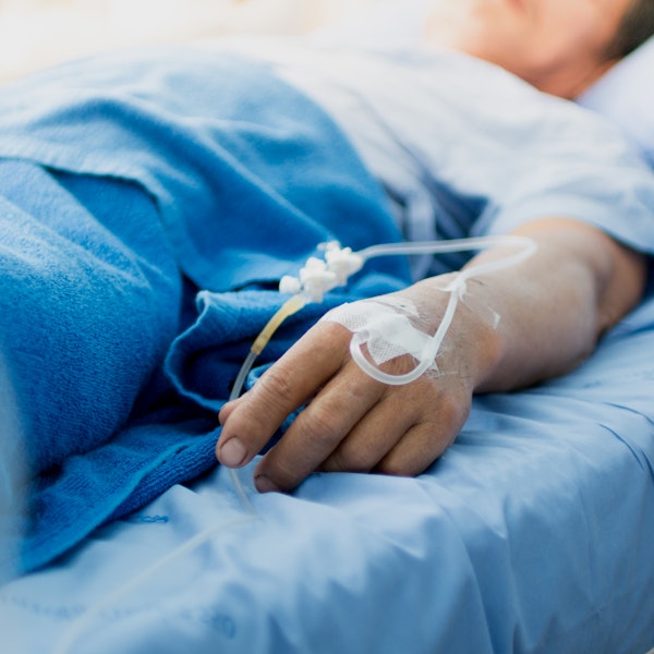 Mature man in hospital bed