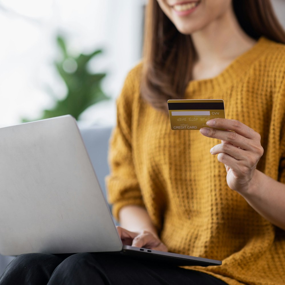 woman holding credit card