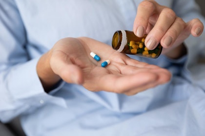 Pills being poured into hand