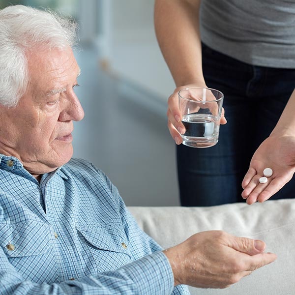 Mature man taking pills