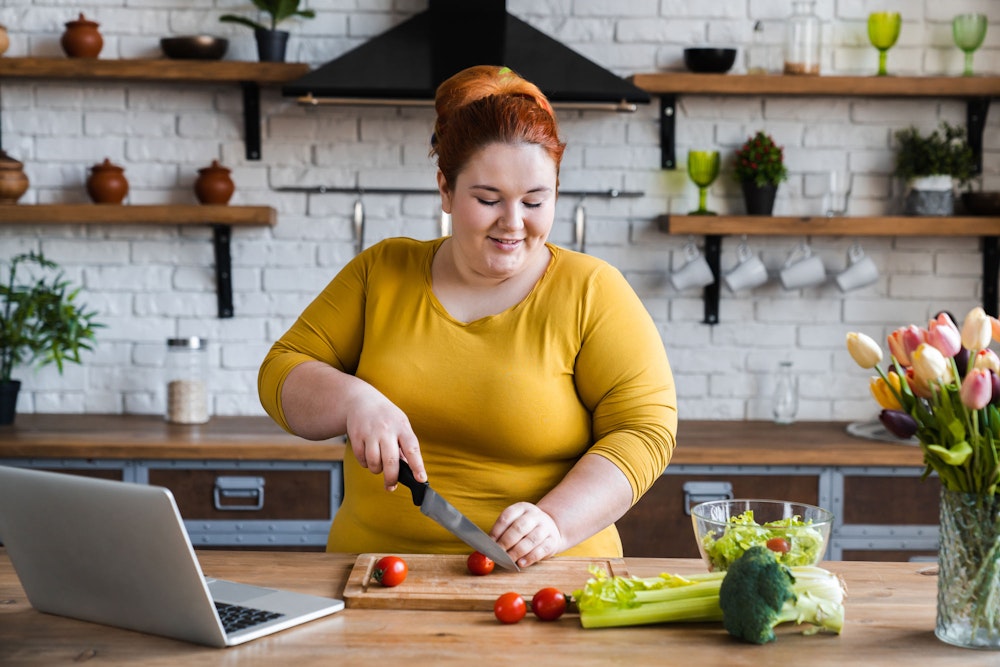 Woman cutting vegetables
