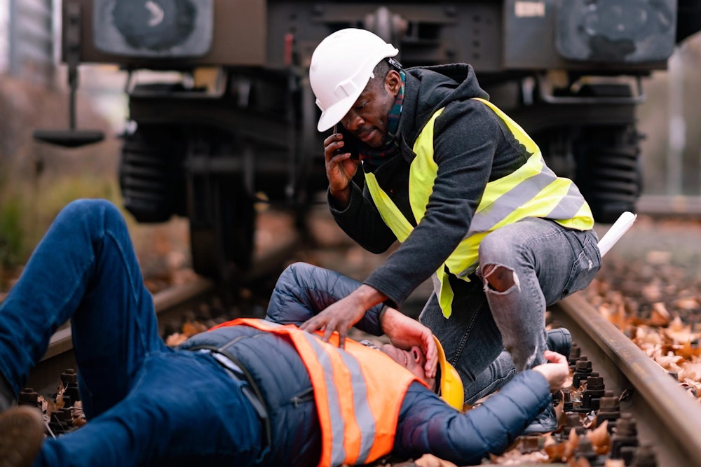 Railroad worker calling in his coworker