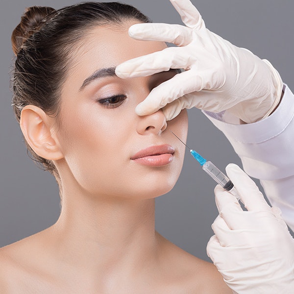 Woman receiving rhinoplasty