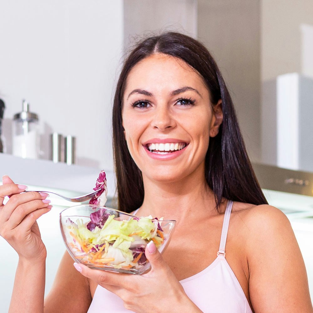 Smiling woman eating