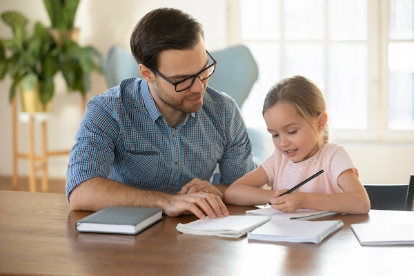 Parent helping child with school work