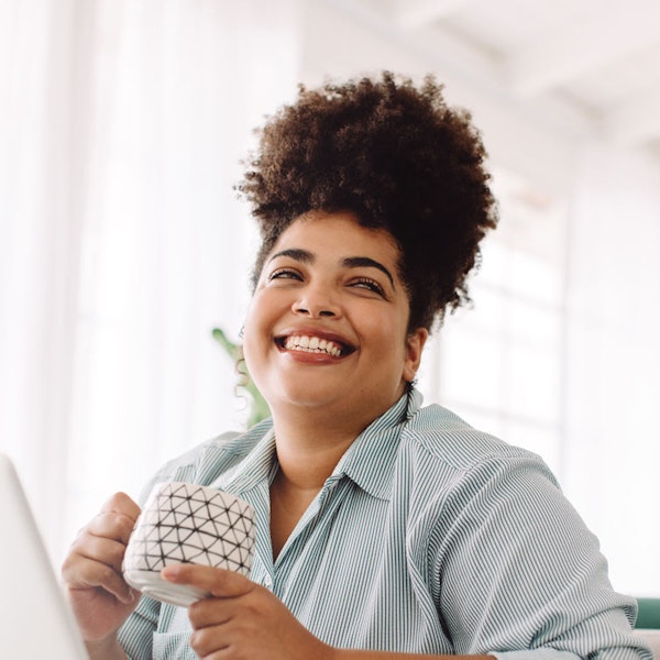 Smiling woman on virtual call