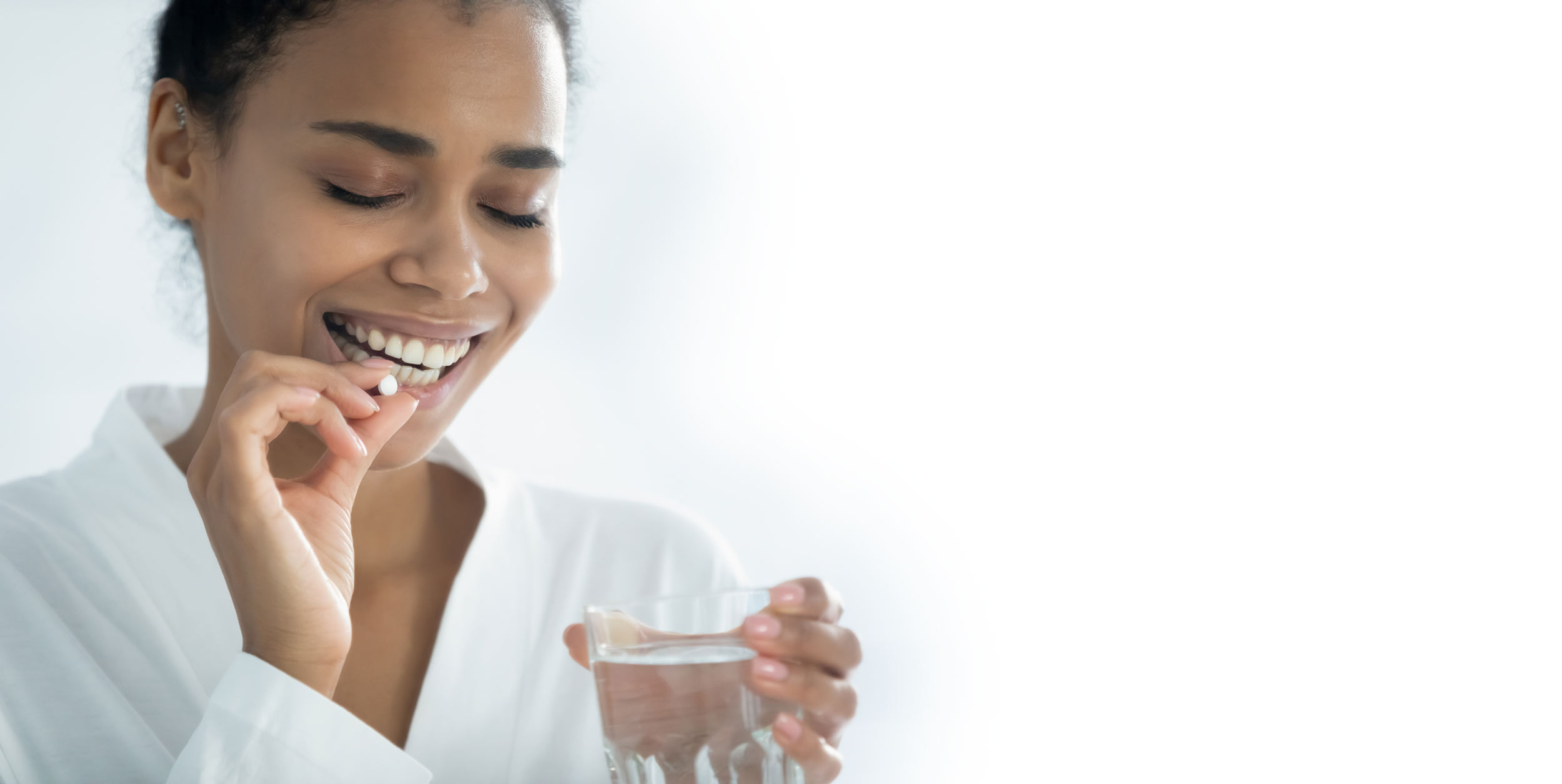 Woman taking oral sedation pill
