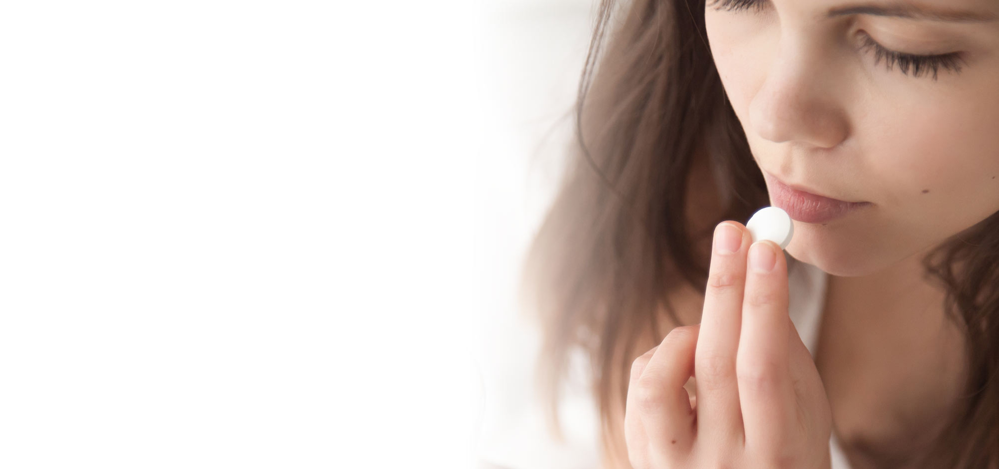 Woman taking pill