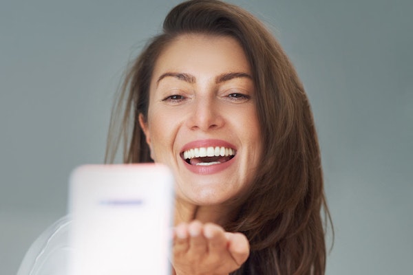 Mature woman taking a selfie and smiling
