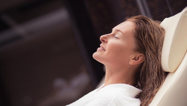 Smiling woman enjoying spa
