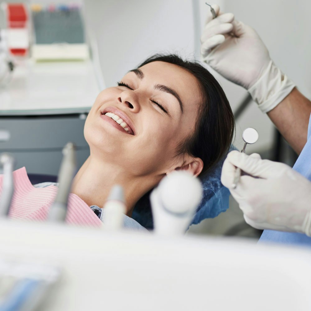 Dental patient with closed eyes about to undergo sedation