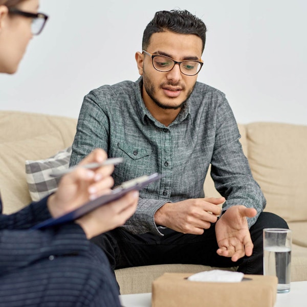 Man speaking with a therapist