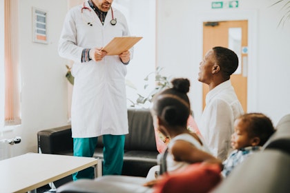Hospital administrator talking with patient's family