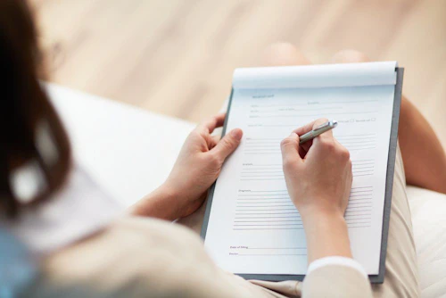 Taking written notes on a notepad