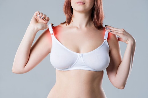 woman with pain caused by her bra's shoulder straps