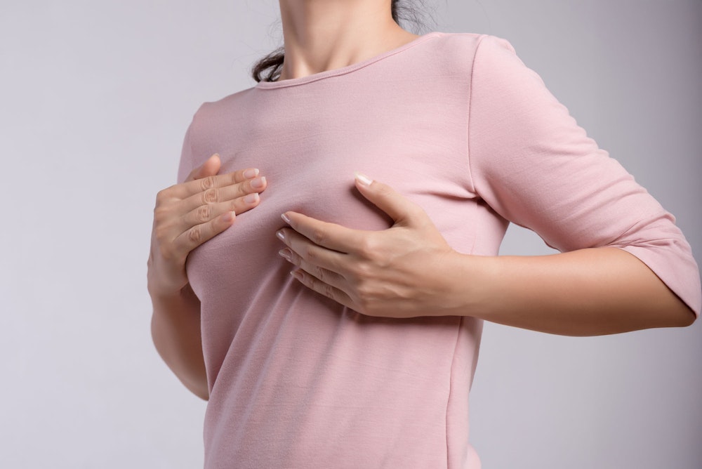 Woman cupping her breast