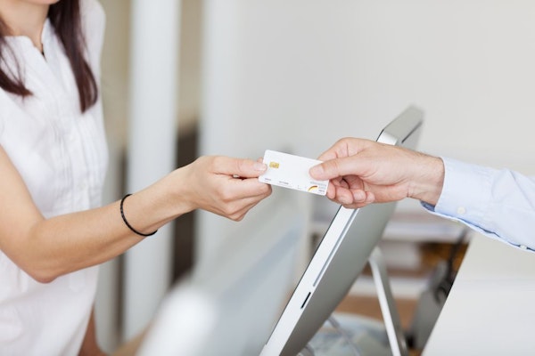 Dental patient paying with a credit card