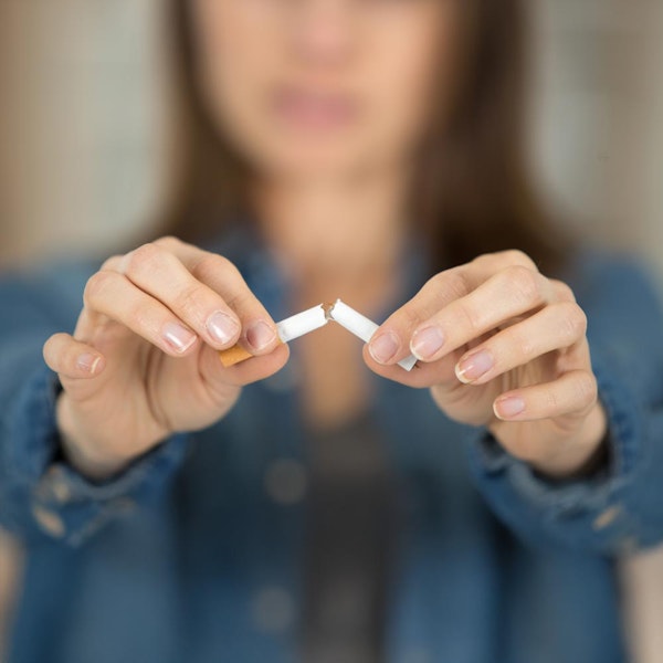 breaking cigarette in half