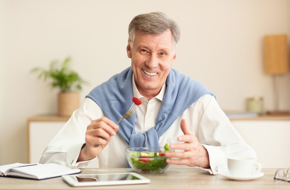 Mature man eating