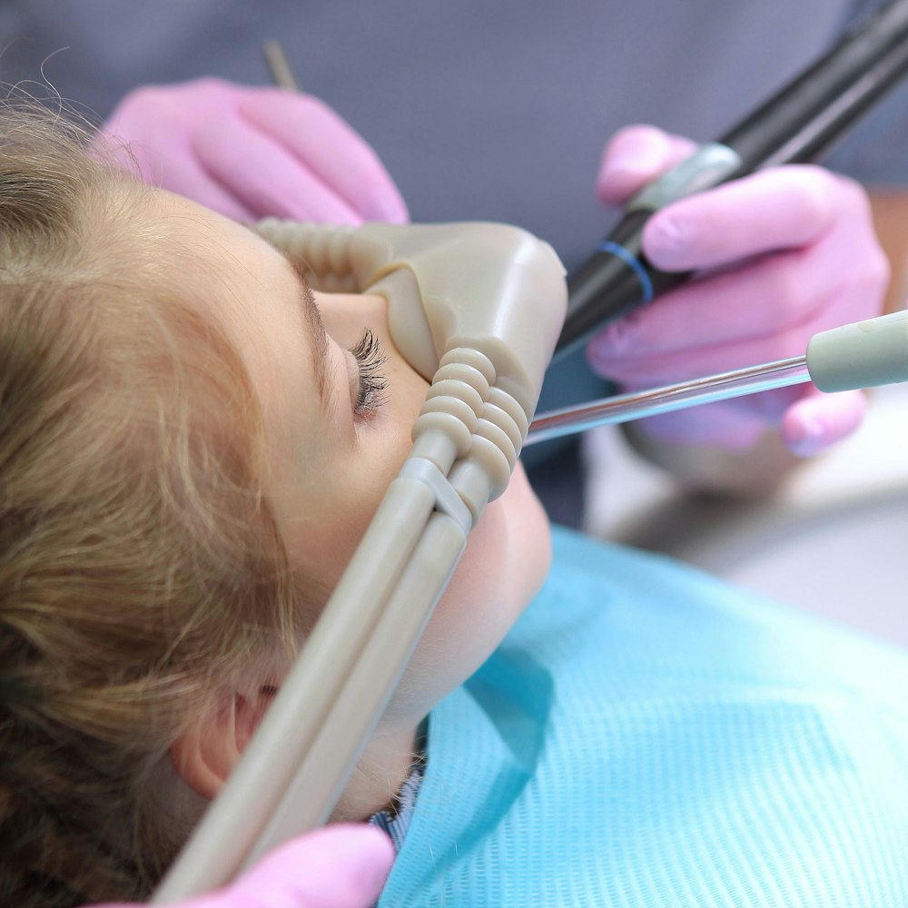 girl inhaling nitrous oxide