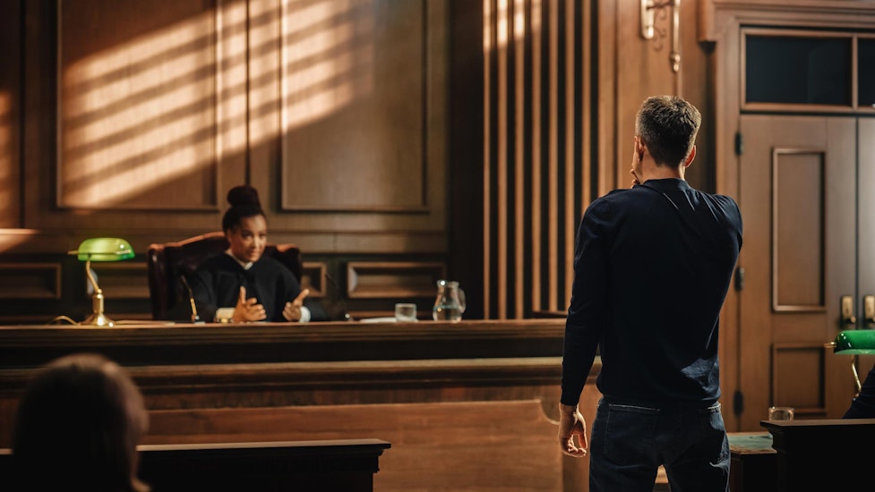 Man in front of a judge