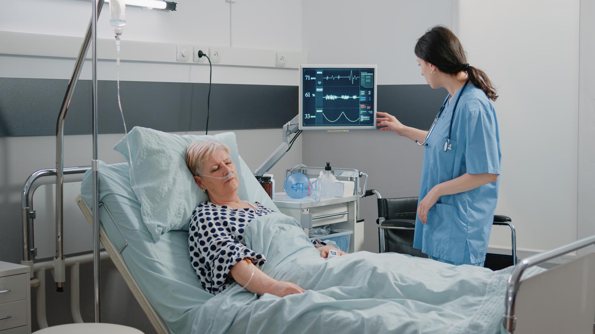 Nurse checking EKG of patient