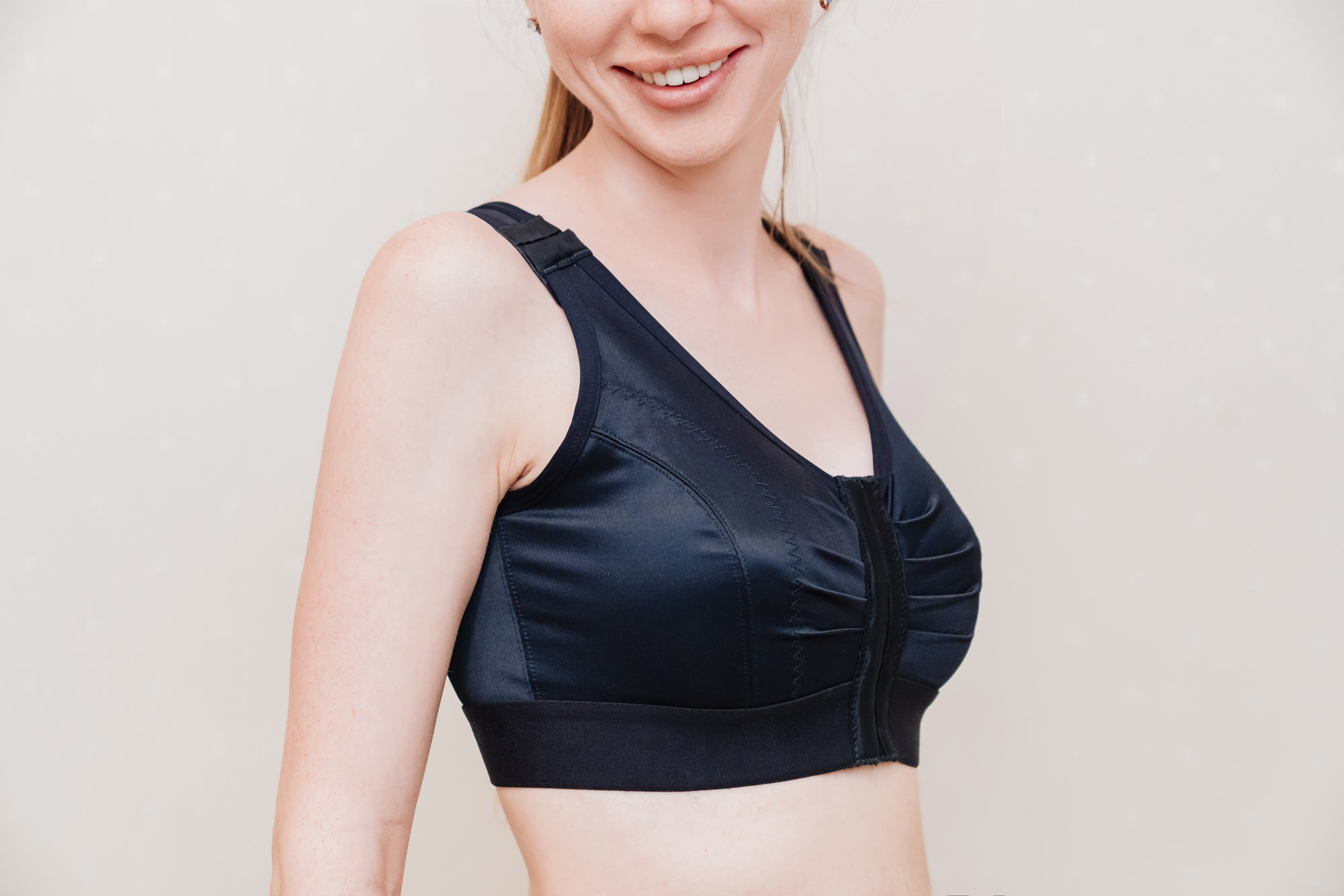 Woman wearing a compression bra after breast reduction