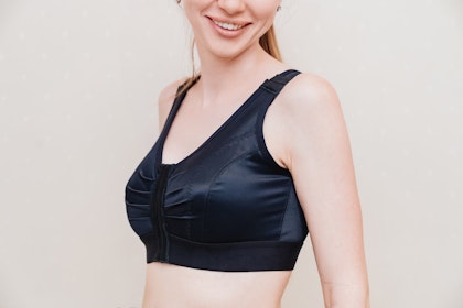 Woman wearing a compression bra after breast reduction