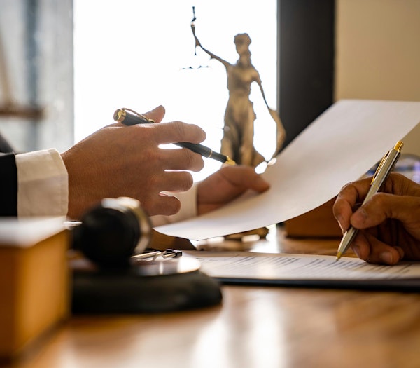 Lawyers discussing paperwork