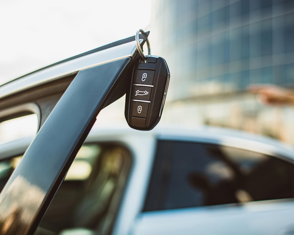 Car keys hanging on a car door