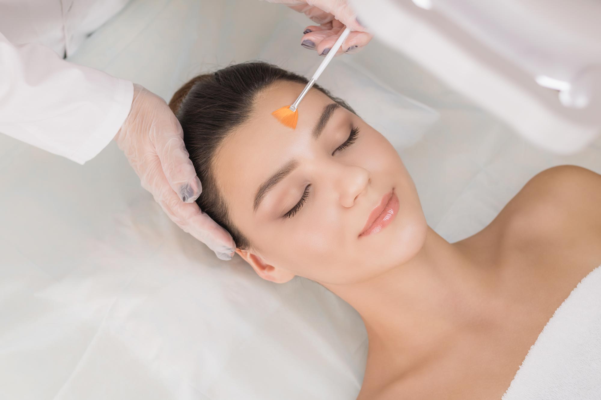 Woman getting a chemical peel