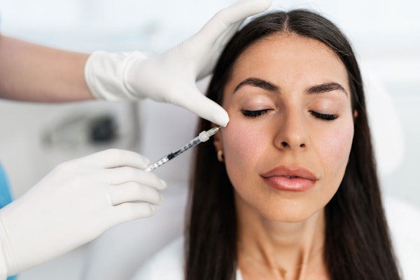 woman receiving injectable
