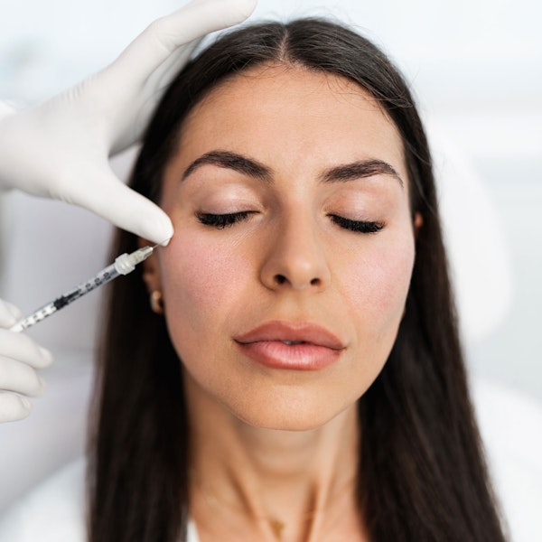 woman receiving injectable