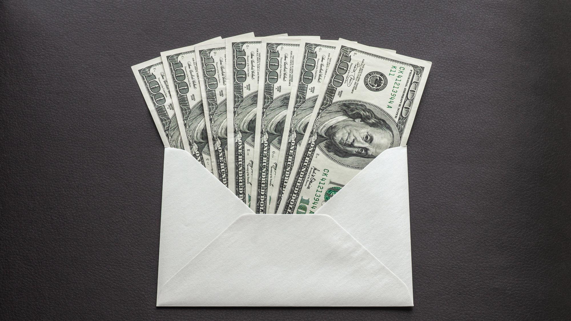 hundred-dollar bills in envelope