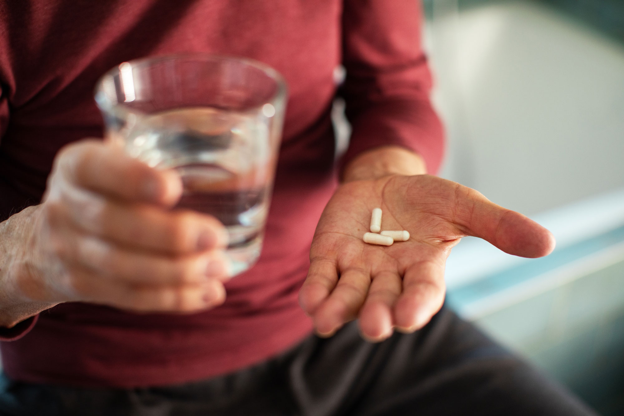 Nursing home resident holding pills