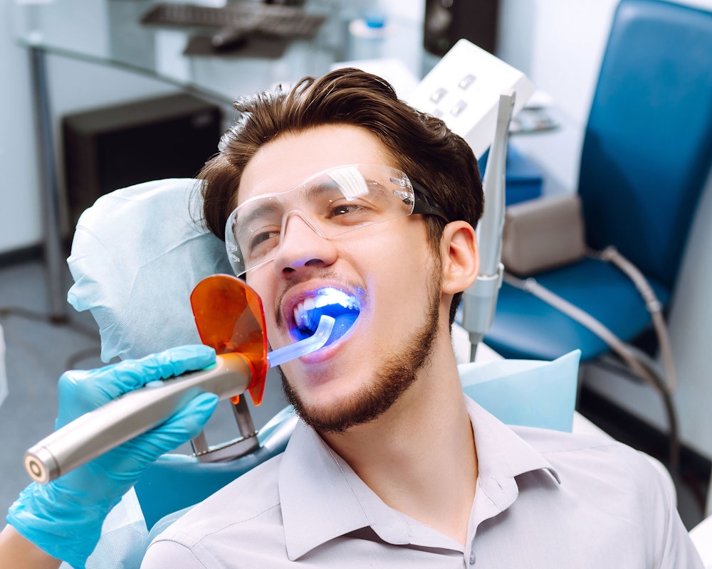 man being treated with laser dentistry