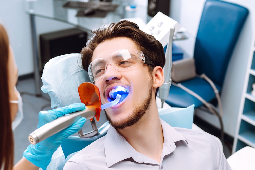 man being treated with laser dentistry