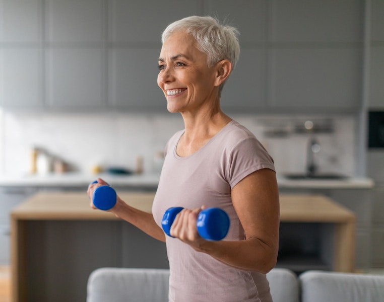 Woman using arm weights