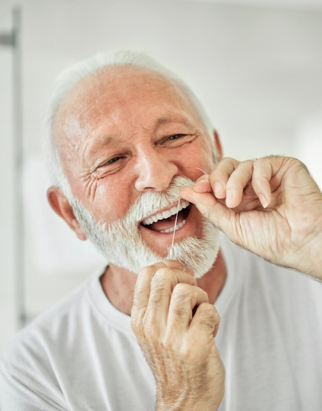 man flossing