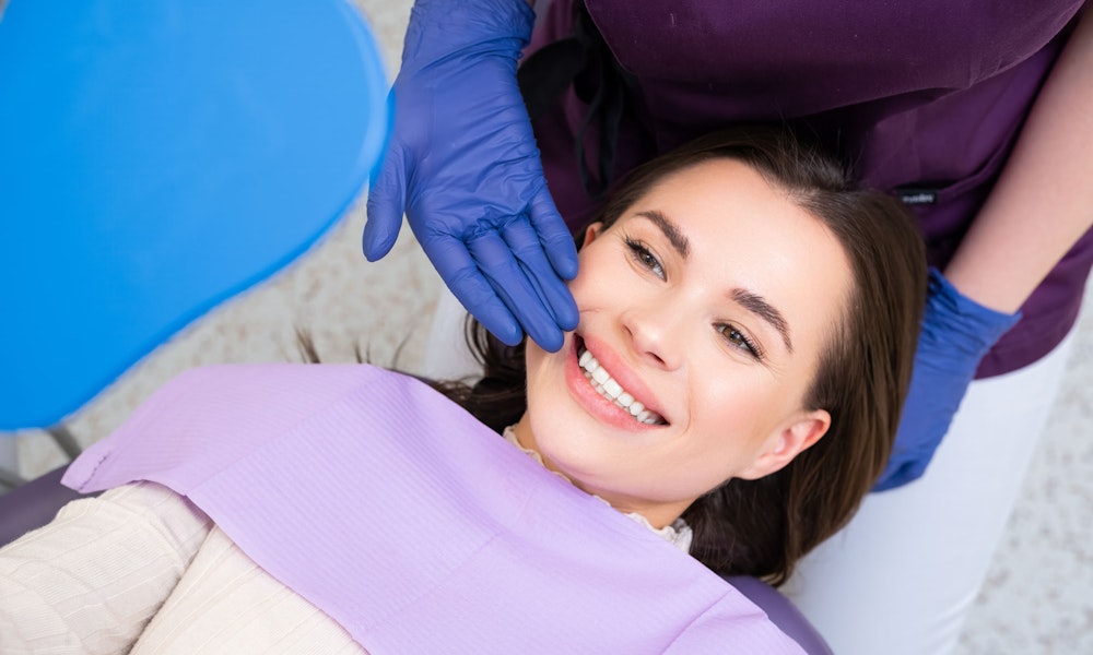Woman with a beautiful smile after veneers