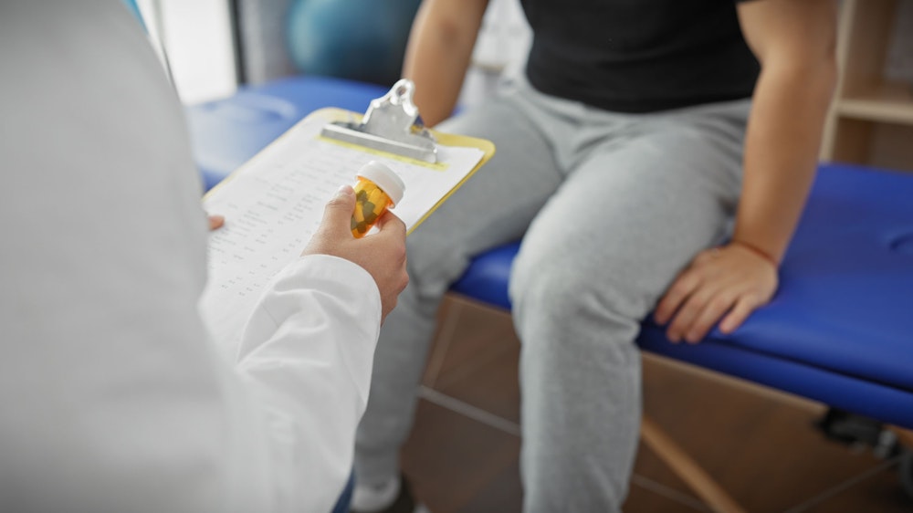 Doctor prescribing a patient medication