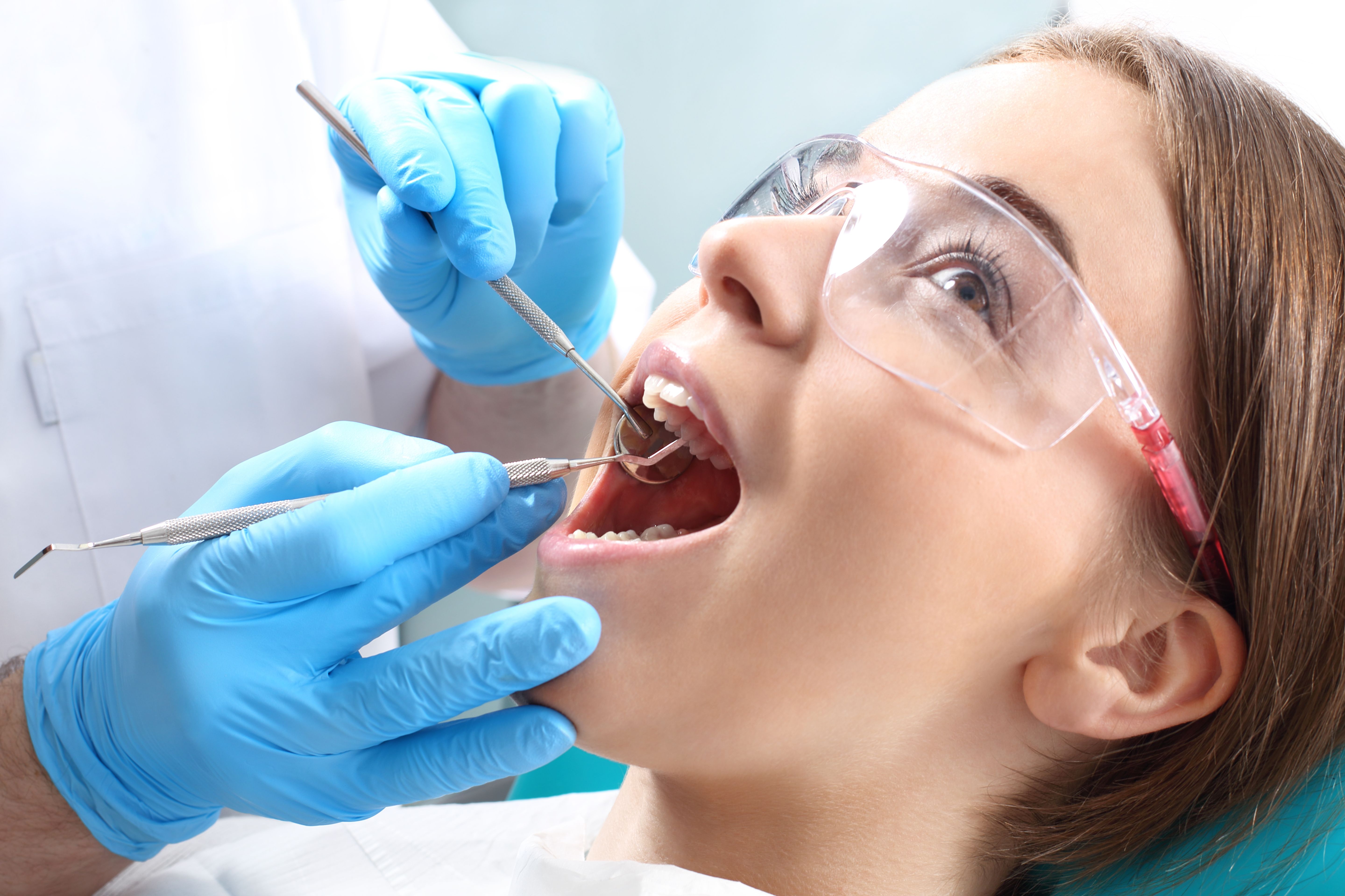 Woman having dental exam done