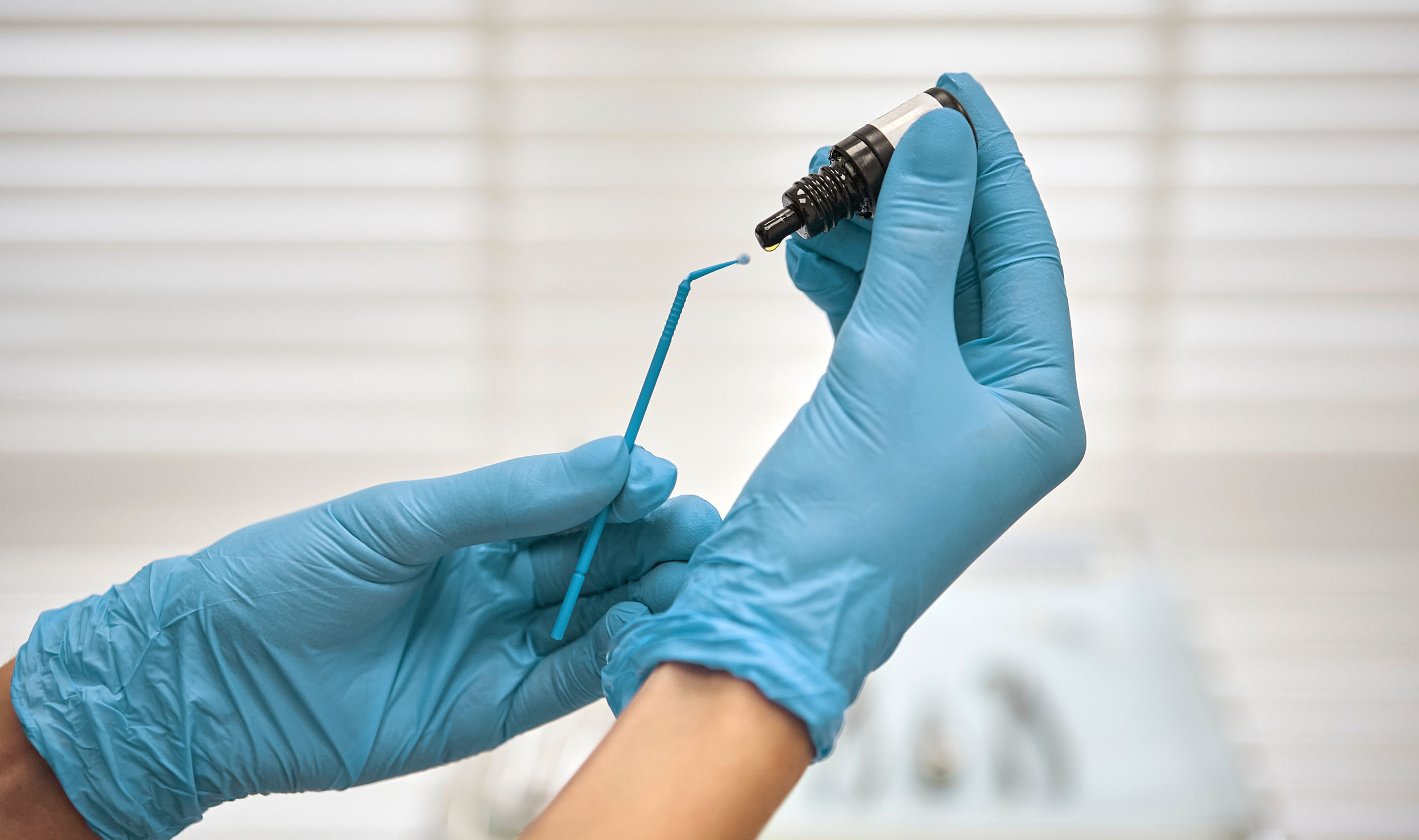 dentist preparing resin for dental bonding