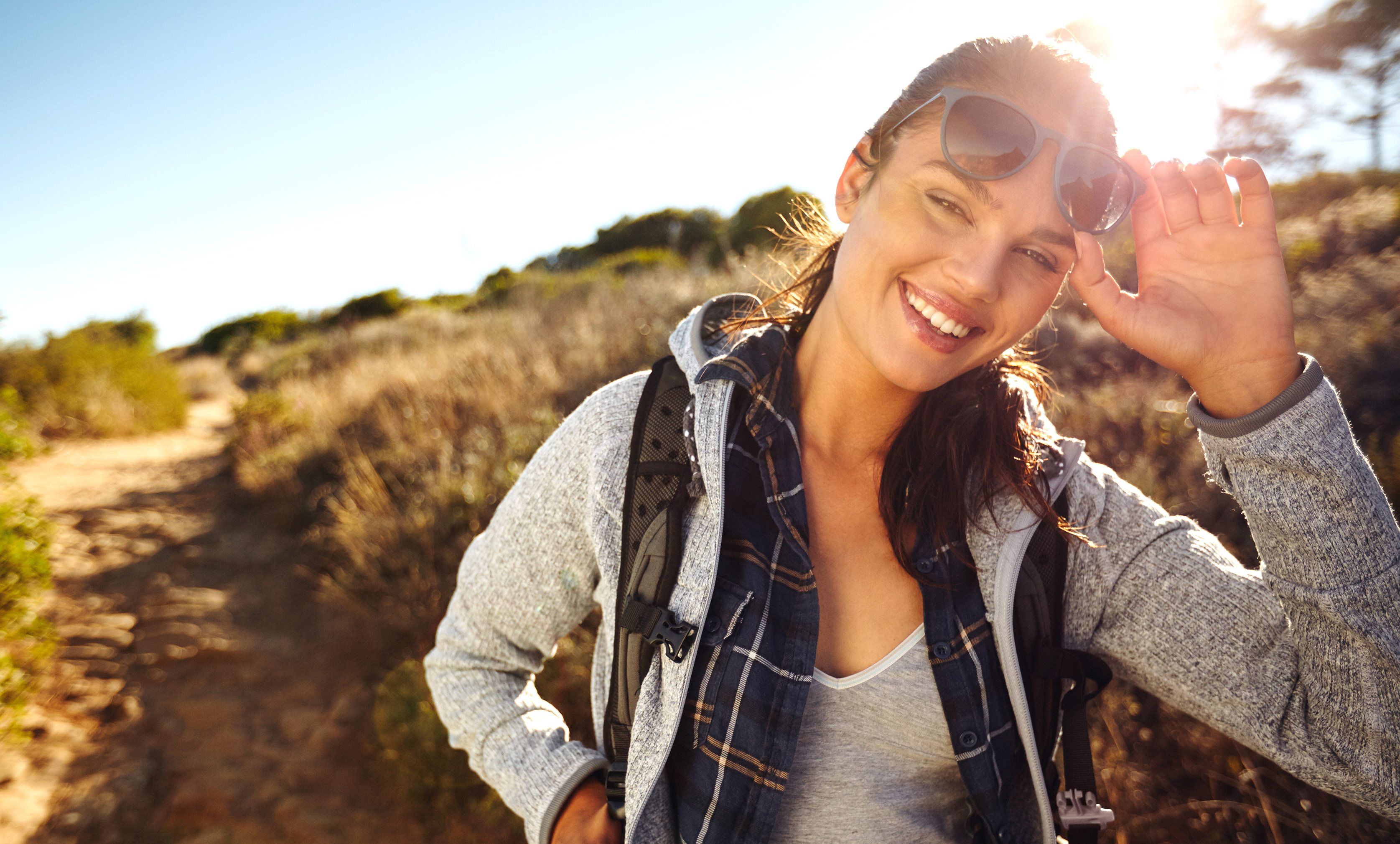 woman wearing sunglasses outside in the sun