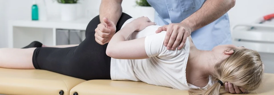 Photo of woman receiving chiropractic treatment