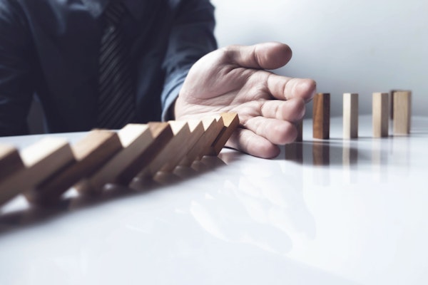 hand with dominoes