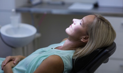 A woman looking relaxed in a dental chair
