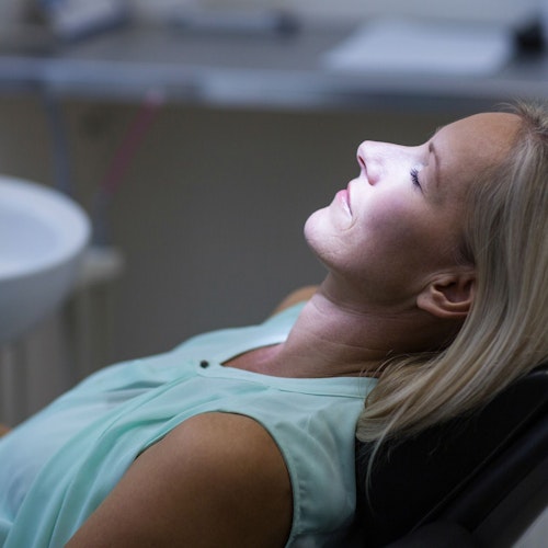 A woman looking relaxed in a dental chair