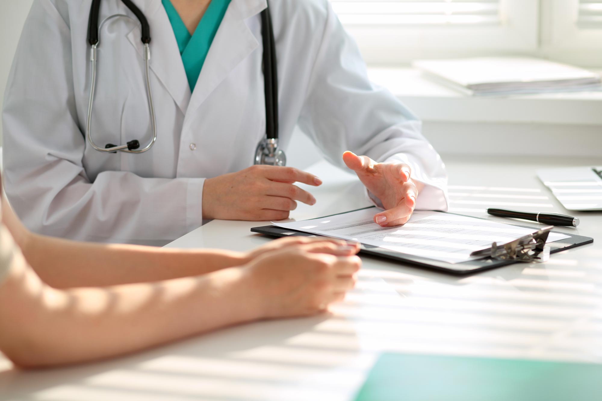 doctor speaking with a patient