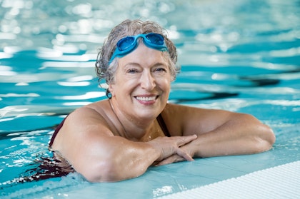 smiling senior woman in pool
